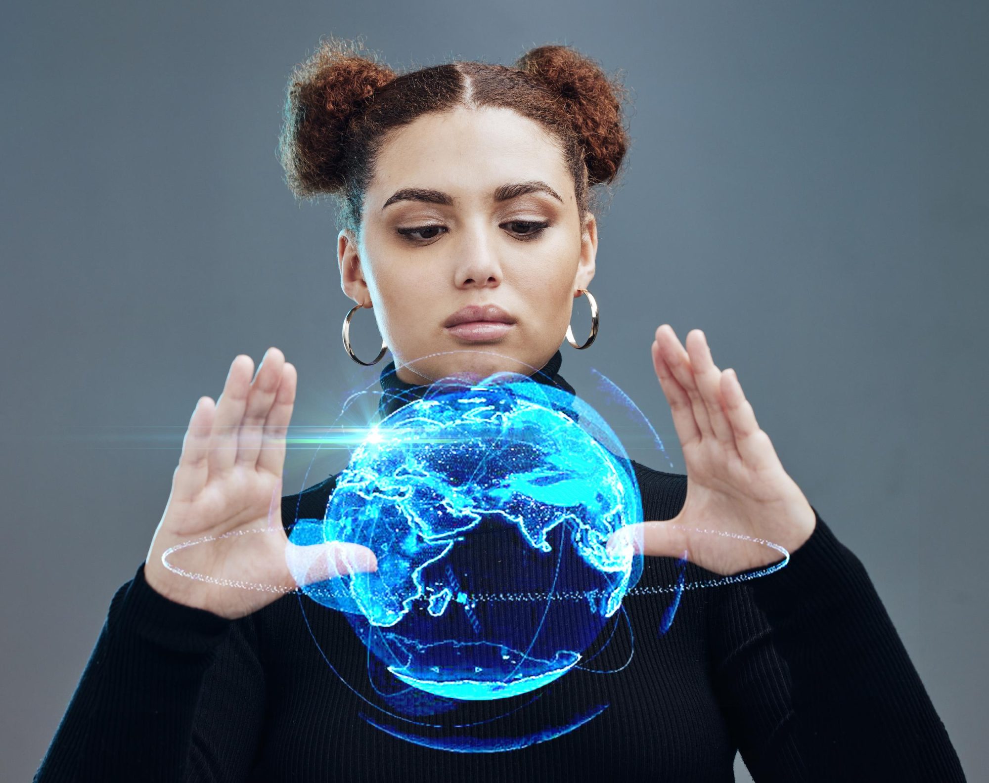 Woman holding futuristic hologram globe